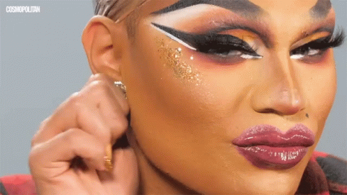 A Close Up Of A Woman 'S Face With Cosmopolitan Written On The Bottom Right GIF