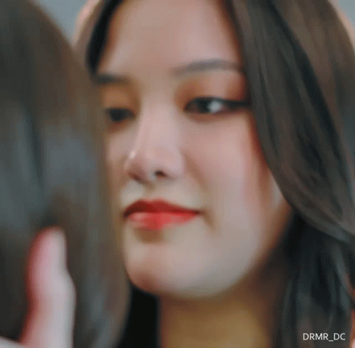 a close up of a woman 's face with drmr_dc written in the corner