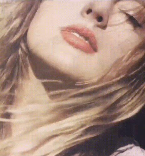 Woman With Eyes Closed And Hair In Wind GIF