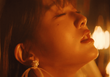 A Close Up Of A Woman 'S Face With Her Eyes Closed And Her Mouth Open GIF