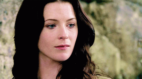 A Close Up Of A Woman 'S Face With Her Eyes Closed GIF