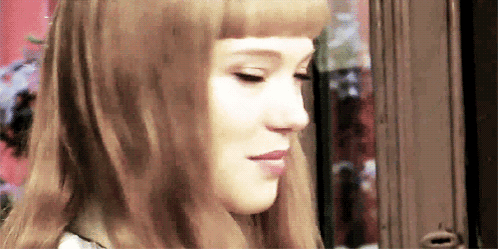 A Close Up Of A Woman 'S Face With Her Eyes Closed GIF