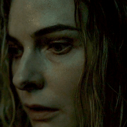 A Close Up Of A Woman 'S Face With Her Eyes Closed GIF