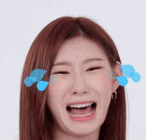 A Close Up Of A Woman 'S Face With Her Mouth Open And Blue Bubbles Coming Out Of Her Eyes . GIF