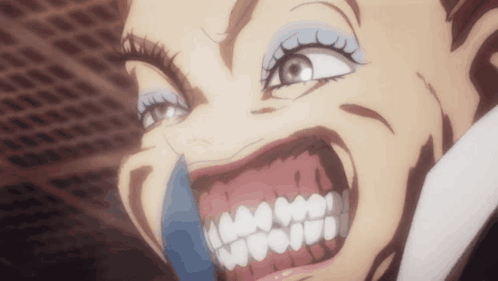 A Close Up Of A Woman 'S Face With Her Mouth Open And Teeth Showing GIF