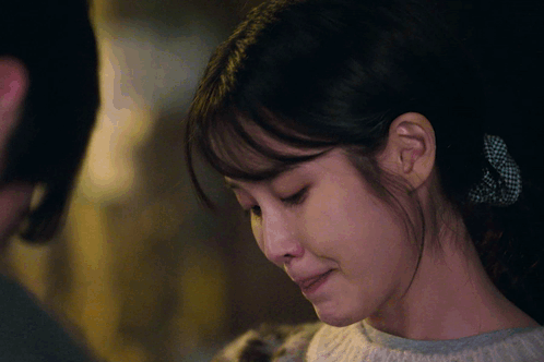 A Close Up Of A Woman 'S Face With Her Mouth Open GIF