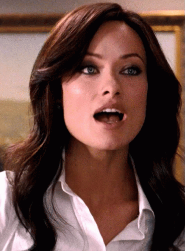 A Close Up Of A Woman 'S Face With Her Mouth Wide Open GIF