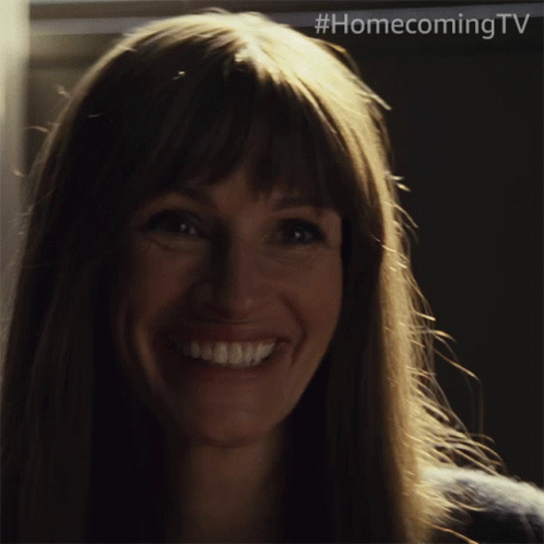 A Close Up Of A Woman 'S Face With #Homecomingtv Written On The Bottom GIF