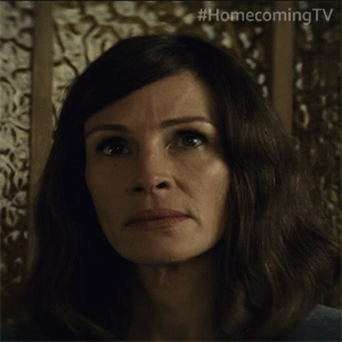 A Close Up Of A Woman 'S Face With #Homecomingtv Written On The Bottom GIF