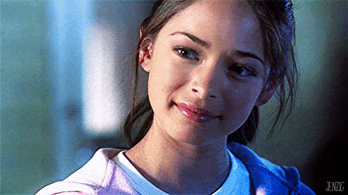 A Close Up Of A Woman 'S Face With Jenzg Written On The Bottom Right Corner GIF