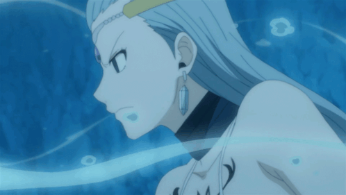 A Close Up Of A Woman 'S Face With Long White Hair And Earrings GIF