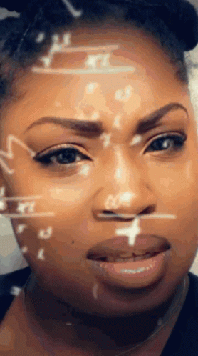 A Close Up Of A Woman 'S Face With Mathematical Symbols On It GIF
