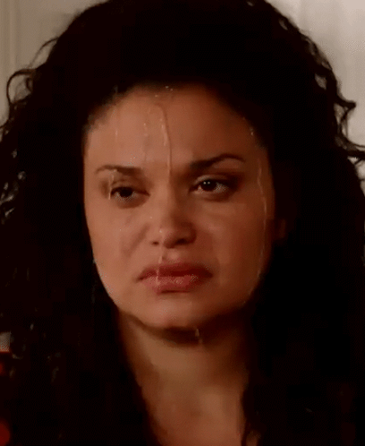 A Close Up Of A Woman 'S Face With Milk Dripping From Her Nose . GIF