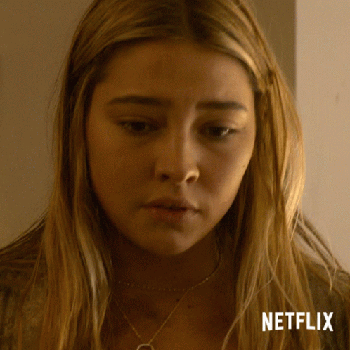 A Close Up Of A Woman 'S Face With Netflix Written In The Corner GIF