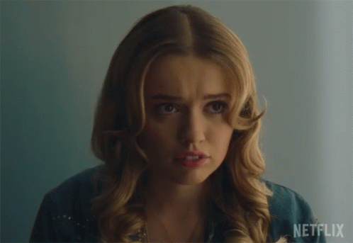 A Close Up Of A Woman 'S Face With Netflix Written On The Bottom GIF