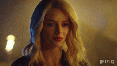 A Close Up Of A Woman 'S Face With Netflix Written On The Bottom GIF