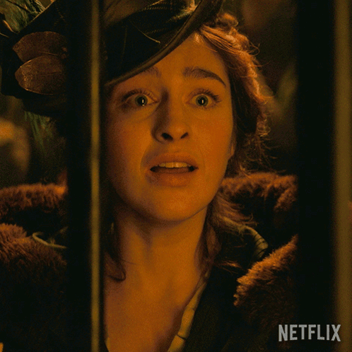 A Close Up Of A Woman 'S Face With Netflix Written On The Bottom Right GIF
