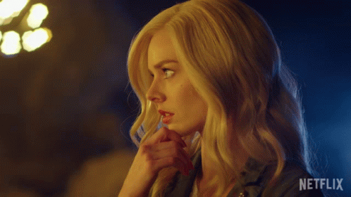 A Close Up Of A Woman 'S Face With Netflix Written On The Bottom Right GIF