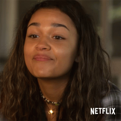 A Close Up Of A Woman 'S Face With Netflix Written On The Bottom GIF