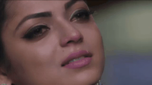 A Close Up Of A Woman 'S Face With Pink Lipstick On GIF