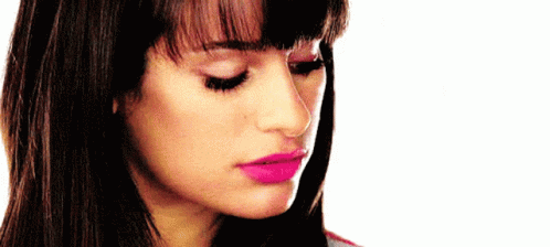 A Close Up Of A Woman 'S Face With Pink Lipstick On GIF