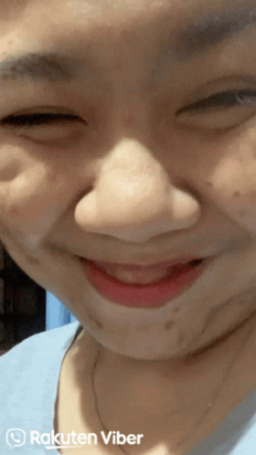 A Close Up Of A Woman 'S Face With Rakuten Viber Written On The Bottom Right GIF