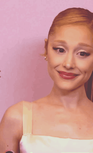 A Close Up Of A Woman 'S Face With Red Lips GIF
