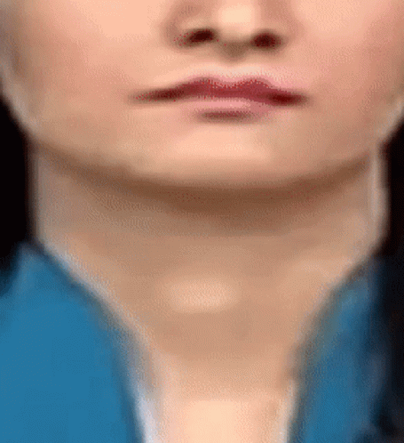 A Close Up Of A Woman 'S Face With Red Lips GIF