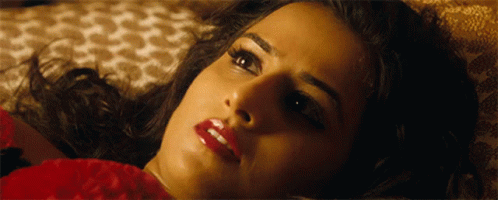 A Close Up Of A Woman 'S Face With Red Lips GIF