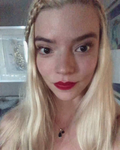 A Close Up Of A Woman 'S Face With Red Lipstick GIF