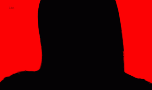 A Close Up Of A Woman 'S Face With Red Lipstick And A Red Background GIF