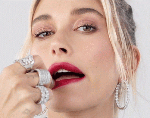 A Close Up Of A Woman 'S Face With Red Lipstick GIF