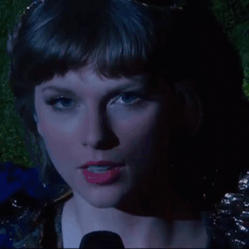 A Close Up Of A Woman 'S Face With Red Lipstick GIF