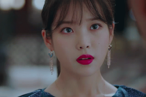 A Close Up Of A Woman 'S Face With Red Lipstick GIF