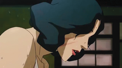 A Close Up Of A Woman 'S Face With Sweat Coming Out Of Her Face . GIF