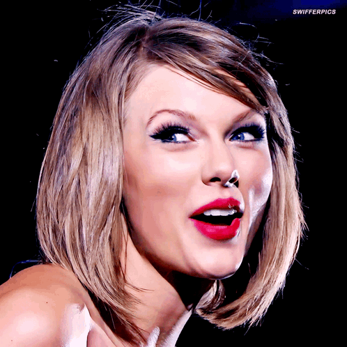 A Close Up Of A Woman 'S Face With Swifterpics Written On The Bottom Left GIF