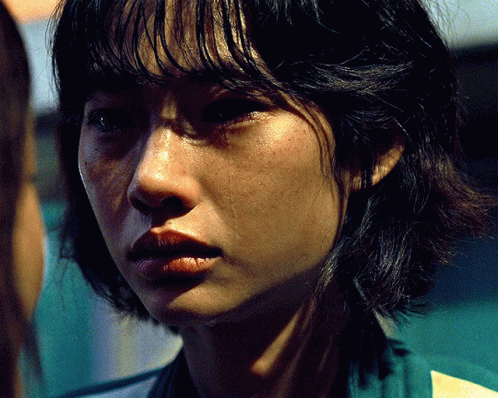 A Close Up Of A Woman 'S Face With Tears Coming Out Of Her Eyes GIF