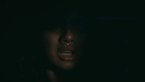 A Close Up Of A Woman 'S Face With Tears Running Down Her Cheeks GIF