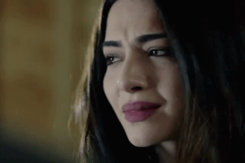 A Close Up Of A Woman 'S Face With Tears Running Down Her Face . GIF