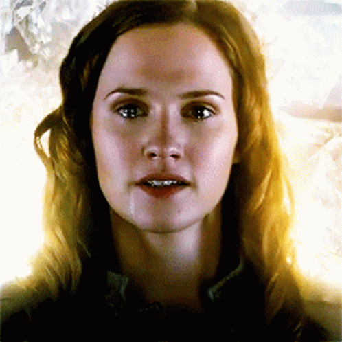 A Close Up Of A Woman 'S Face With Tears Running Down Her Face GIF