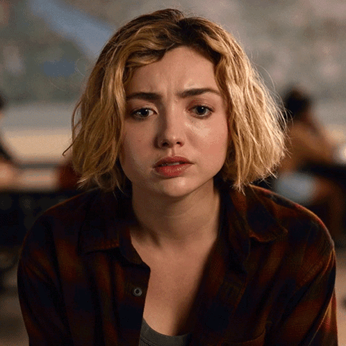 A Close Up Of A Woman 'S Face With Tears Running Down Her Face GIF