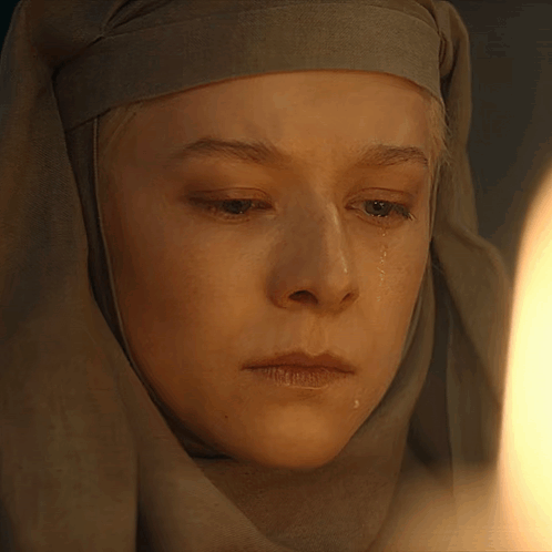 A Close Up Of A Woman 'S Face With Tears Running Down Her Face GIF