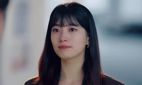 A Close Up Of A Woman 'S Face With Tears Running Down Her Face GIF