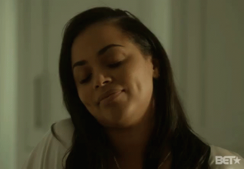 A Close Up Of A Woman 'S Face With The Bet Logo In The Corner GIF