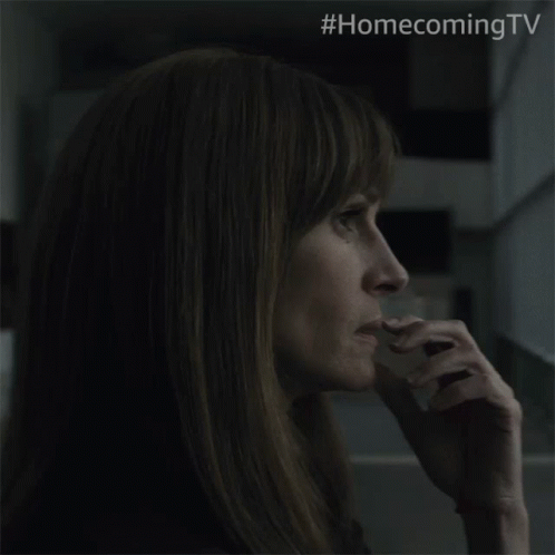 A Close Up Of A Woman 'S Face With The Hashtag #Homecomingtv On The Bottom GIF