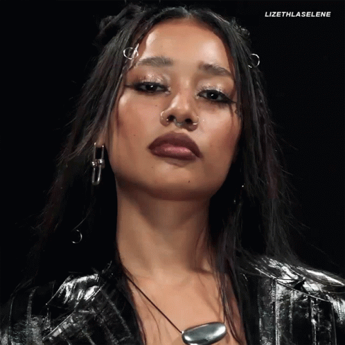 A Close Up Of A Woman 'S Face With The Hashtag Lizethlaselene At The Top GIF