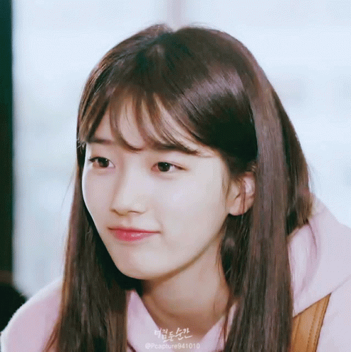 A Close Up Of A Woman 'S Face With The Hashtag Pccapture941010 On The Bottom GIF
