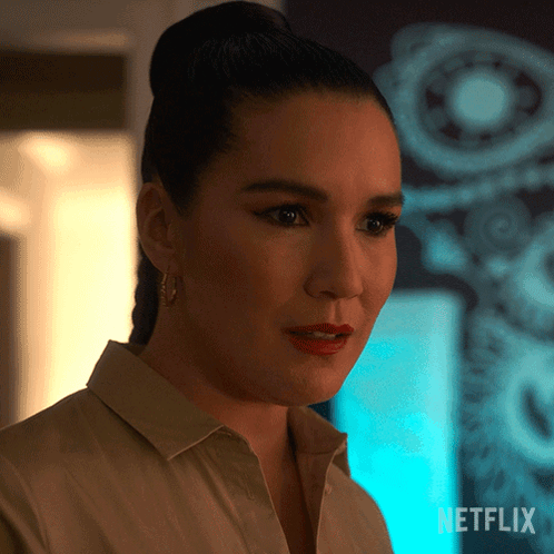 A Close Up Of A Woman 'S Face With The Netflix Logo In The Corner GIF