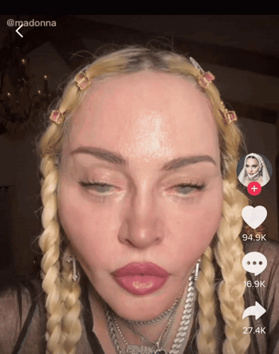 A Close Up Of A Woman 'S Face With The Number 27.4K On The Bottom GIF