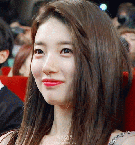 A Close Up Of A Woman 'S Face With The Number 41010 On The Bottom GIF